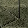 HUARTE erdőzöld rövid szálú puha és mosható szőnyeg Ø 120 cm