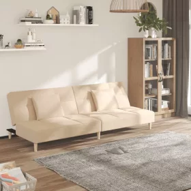   Kétszemélyes krémszínű szövet kanapéágy két párnával