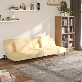   Kétszemélyes krémszínű bársony kanapéágy két párnával